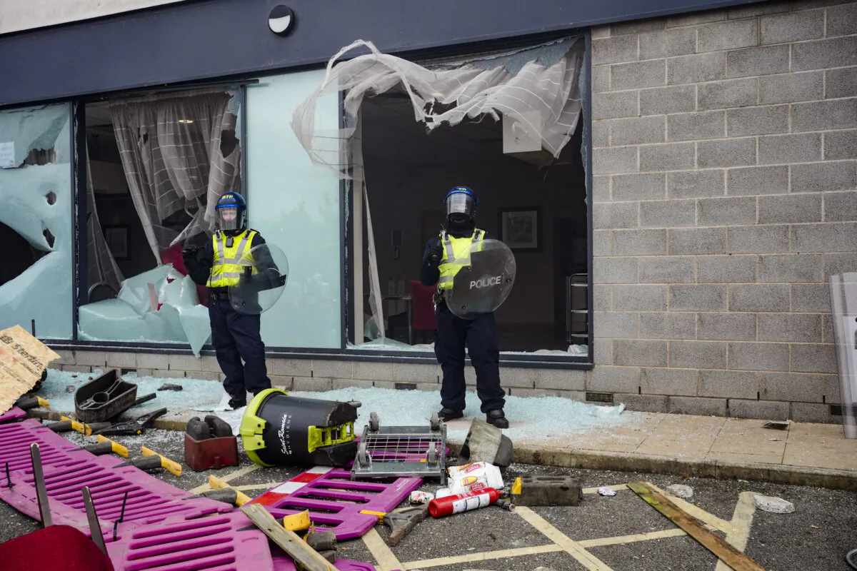 Police officers during an anti-immigration demonstration outside the Holiday Inn Express in Rotherham, South Yorkshire, England, on Aug 4, 2024. (Danny Lawson/PA Wire)