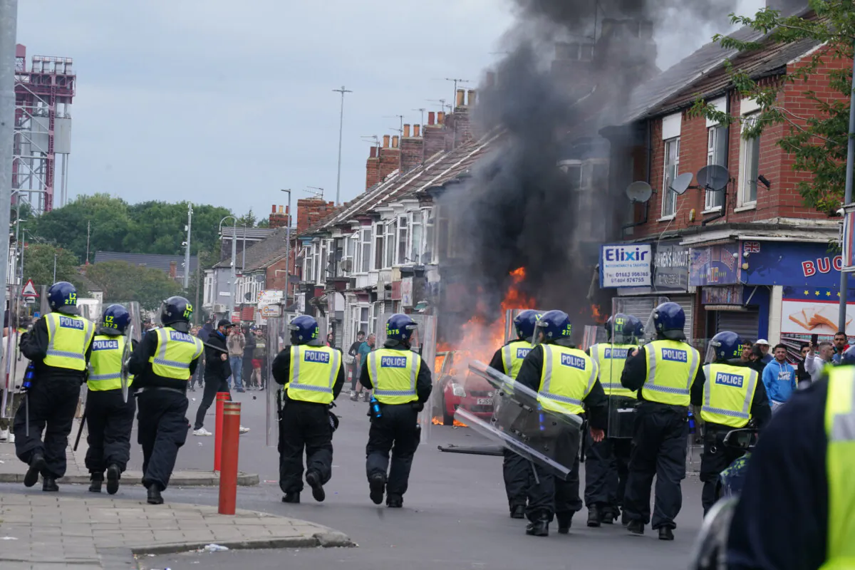 A car burns during an anti-immigration protest in Middlesbrough, England, on Aug. 4, 2024. (Owen Humphreys/PA Wire)
