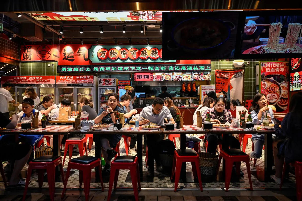People dine at a restaurant at a shopping mall in Beijing, on May 26, 2023. (Jade Gao / AFP via Getty Images)