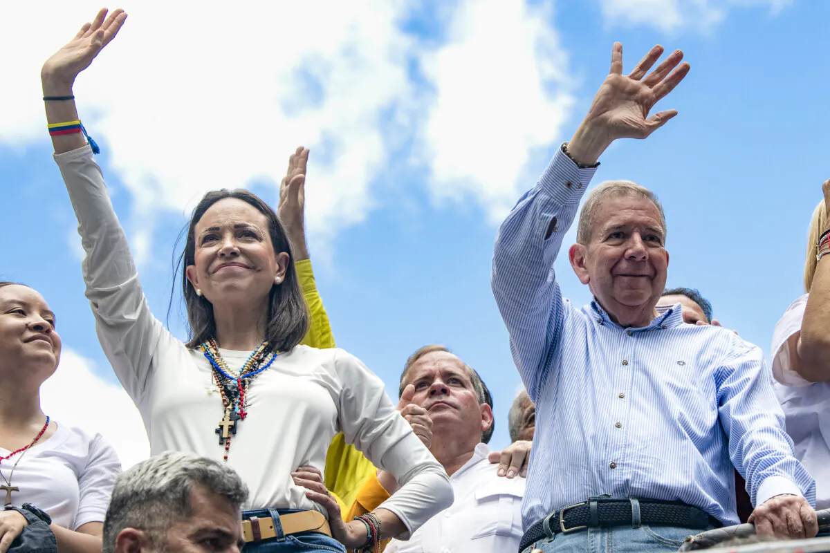 Opposition leader María Corina Machado and opposition presidential candidate Edmundo González greet supporters during a protest against the official result of the presidential election in Caracas, Venezuela, on July 30, 2024. (Alfredo Lasry R/Getty Images)