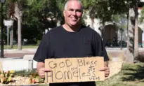 Man Arrested for Holding Sign About Homeless Vets Sues City and Wins