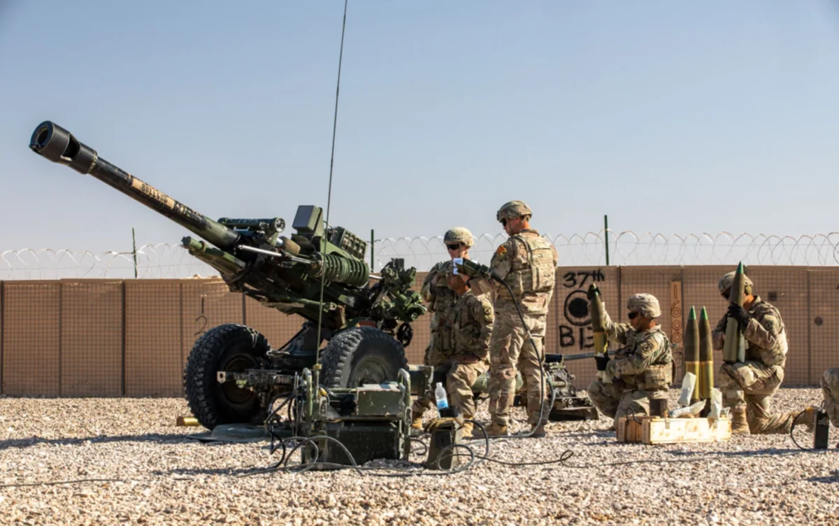 U.S. Soldiers with 2nd Platoon, Bravo Battery, 2-15 Field Artillery, 2nd Brigade Combat Team, 10th Mountain Division conduct an artillery live fire exercise at Al Asad Air Base, Iraq, on Dec. 1, 2023. (U.S. Army photo by Staff Sgt. Quince Lanford/Public Domain)