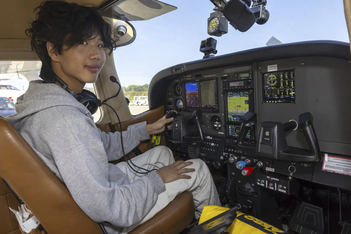 American pilot Ethan Guo poses for the photographer in Geneva, Switzerland, on Aug. 6, 2024, before his take off from Geneva Airport for attempting a world record solo flight to all seven continents.  (Salvatore Di Nolfi/Keystone via AP)