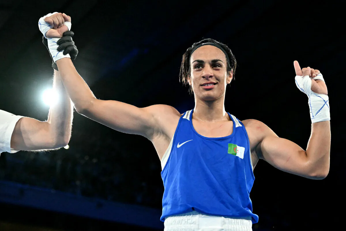 Algeria's Imane Khelif reacts after beating Thailand's Janjaem Suwannapheng in the women's 66kg semifinal boxing match during the Paris Olympic Games at the Roland-Garros Stadium, in Paris on Aug.6, 2024. (Mohd Rasfan/AFP via Getty Images)
