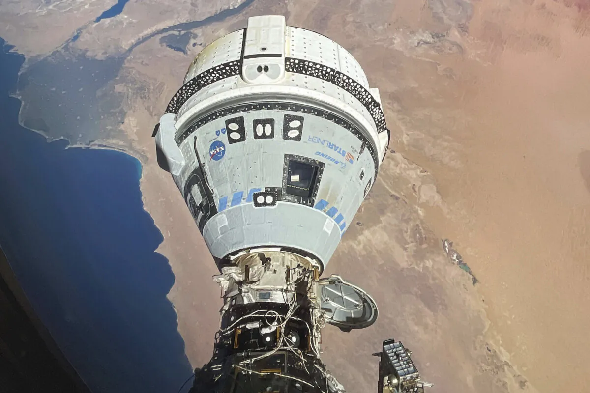 The Starliner spacecraft docked to the Harmony module of the International Space Station, orbiting 262 miles above Egypt's Mediterranean coast, on June 13, 2024. (NASA via AP)