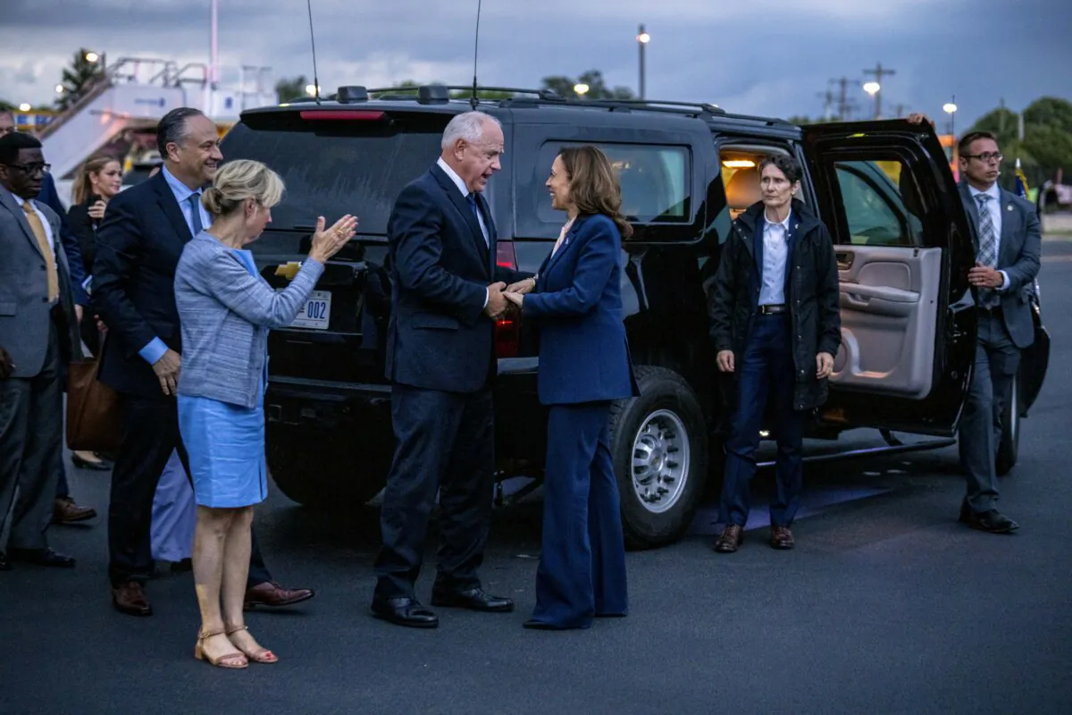 Democratic presidential candidate, Vice President Kamala Harris (C), speaks with Democratic vice presidential candidate Minnesota Gov. Tim Walz, on the tarmac before Harris boards her plane at Philadelphia International Airport in Philadelphia, Pa., on Aug. 6, 2024. (Andrew Harnik/Getty Images)