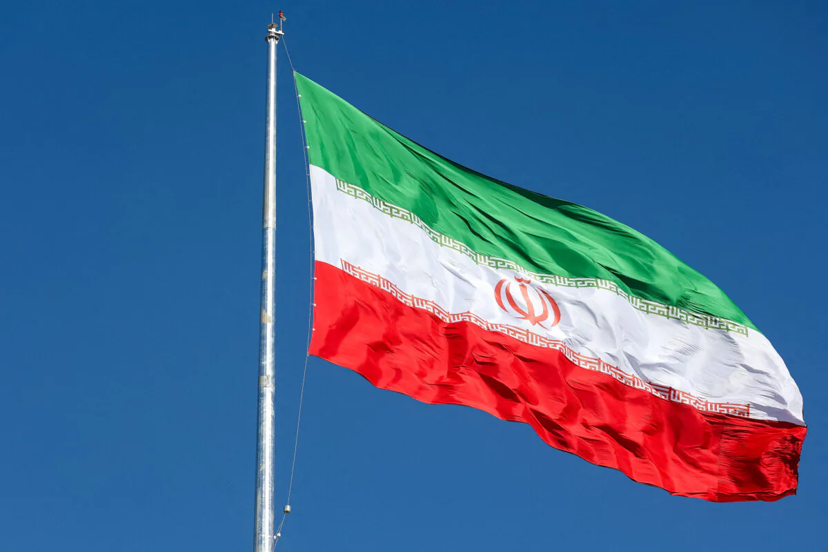 The Iranian flag is seen flying over a street in Tehran, Iran, on Feb. 3, 2023. (Majid Asgaripour/WANA (West Asia News Agency) via Reuters)