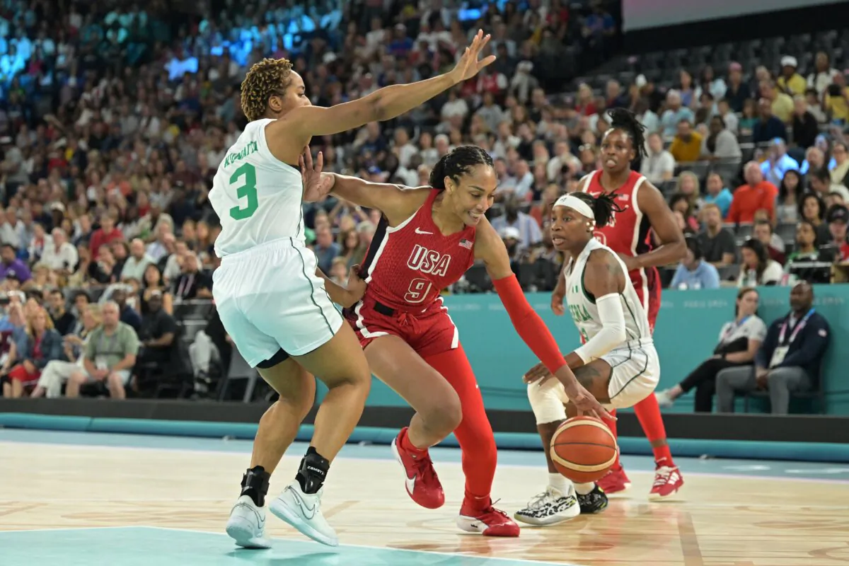 Nigeria's Pallas Kunaiyi-Akpanah (L) defends against A'ja Wilson of Team USA in women's basketball quarterfinal action during the Olympic Games in Paris on Aug. 7, 2024. (Damien Meyer/AFP via Getty Images)