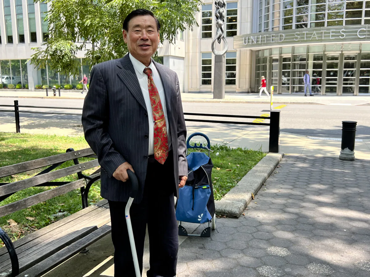 Wang Shujun stands outside federal court in Brooklyn, New York, on July 30, 2024. (Cai Rong/The Epoch Times)