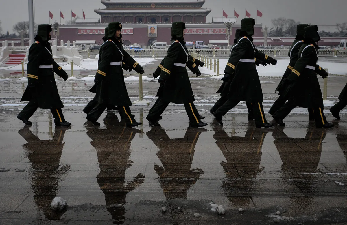 Chinese paramilitary police march on Tiananmen Square in Beijing, in this file photo. (Frederic J. Brown/AFP via Getty Images)