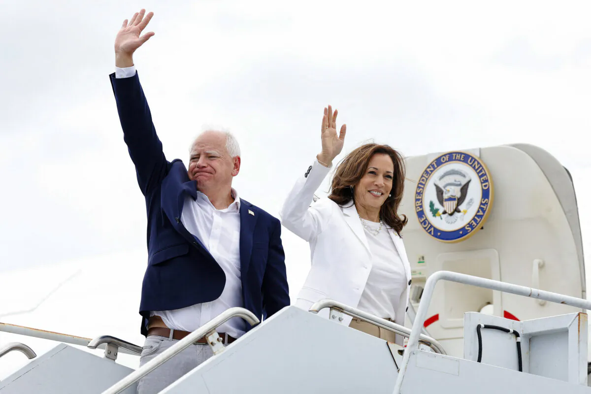 Vice President and 2024 Democratic presidential candidate Kamala Harris and her running mate, Minnesota Gov. Tim Walz, wave as they board Air Force Two, departing Chippewa Valley Regional Airport in Eau Claire, Wis., on Aug. 7, 2024. (KAMIL KRZACZYNSKI/AFP via Getty Images)