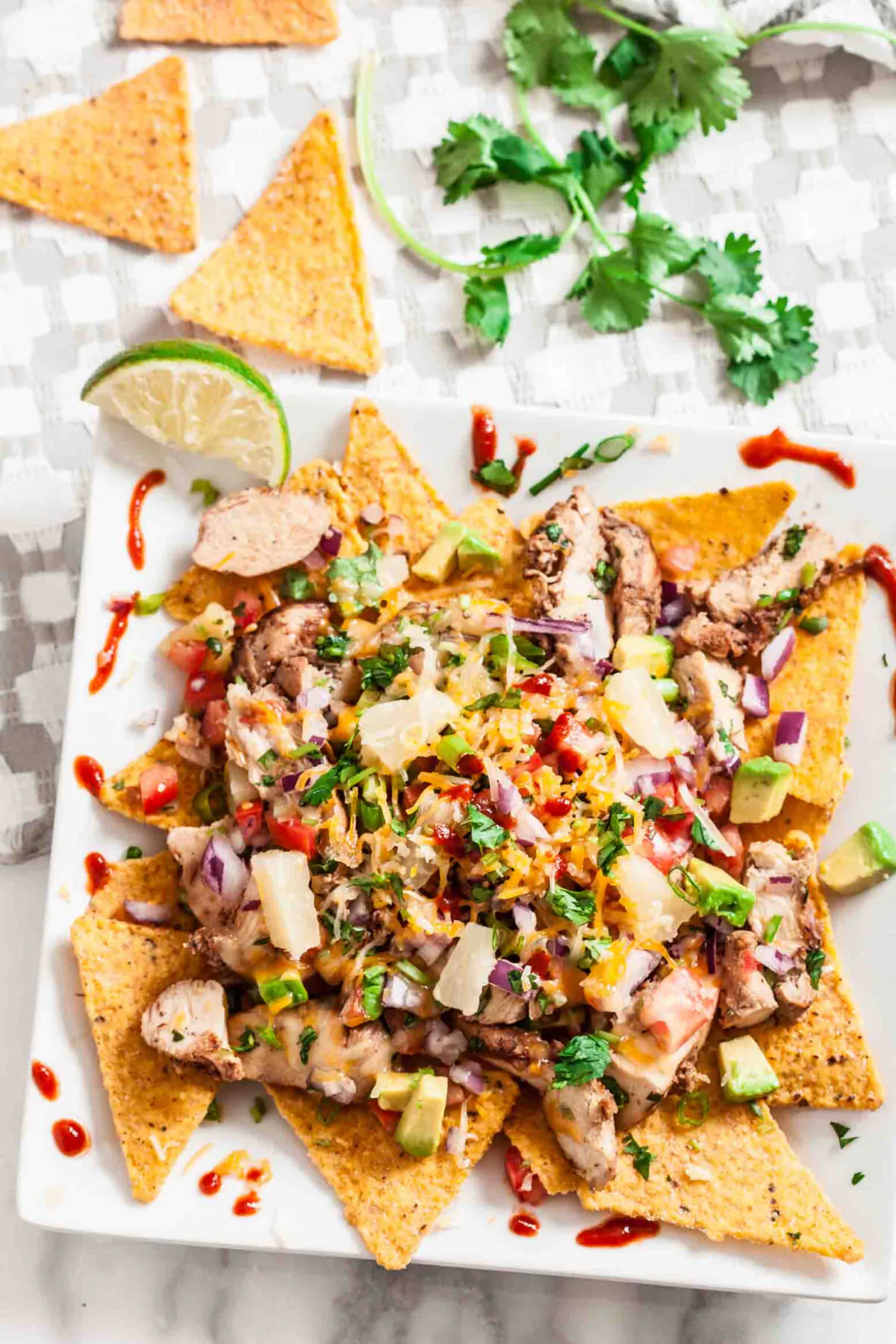 Gather your people around these boldly flavored chicken nachos for parties, game days, or a fun family meal. (Amy Dong)