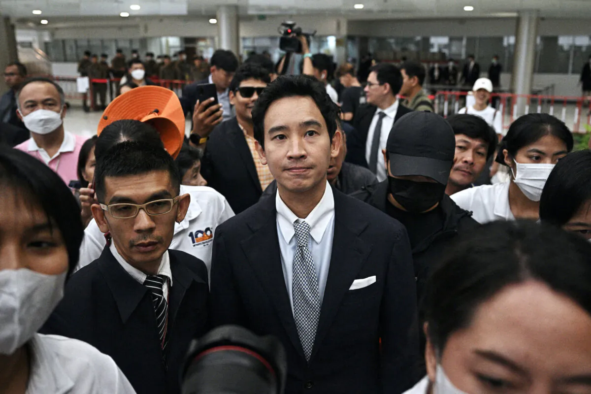 Former Thai prime ministerial candidate and former Move Forward Party (MFP) leader Pita Limjaroenrat (C) leaves the Constitutional Court, after it ruled to ban him from politics for 10 years and dissolve his party over his attempt to reform Thailand's royal defamation laws, in Bangkok on Aug. 7, 2024. (Lillian Suwanrumpha/AFP via Getty Images)