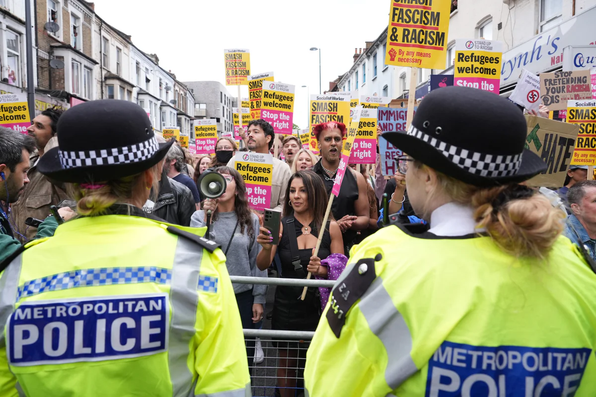 Demonstrators and police officers at an anti-racism protest in Walthamstow, London, on Aug. 7, 2024. (PA Wire)
