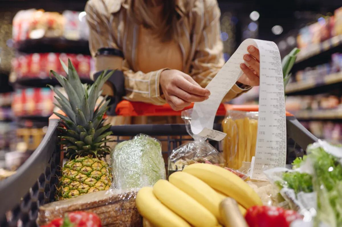 Even high earners are feeling the squeeze as rising costs reshape how Americans borrow, spend, and manage debt. (ViDI Studio/Shutterstock)