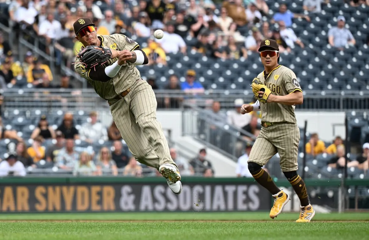 Manny Machado (13) of the San Diego Padres throws to first base to force out Isiah Kiner-Falefa (7) of the Pittsburgh Pirates (not pictured) in the sixth inning during the game in Pittsburgh on Aug. 8, 2024. (Justin Berl/Getty Images)