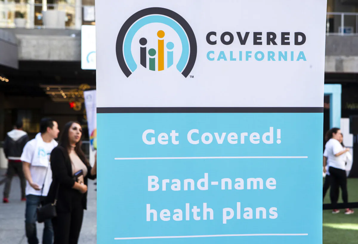 A banner promoting Covered California is displayed during a Covered California Open Enrollment Kickoff Event in Los Angeles on Nov. 4, 2019. (Mel Melcon/Los Angeles Times/TNS)