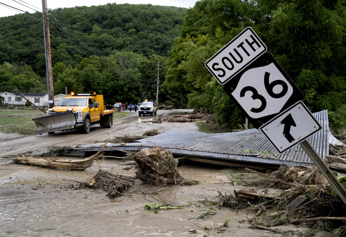Debris from a building is seen along Route 36 in Canisteo, N.Y., on Aug. 9, 2024, after remnants of Tropical Storm Debby swept through the area. (Craig Ruttle/AP Photo)