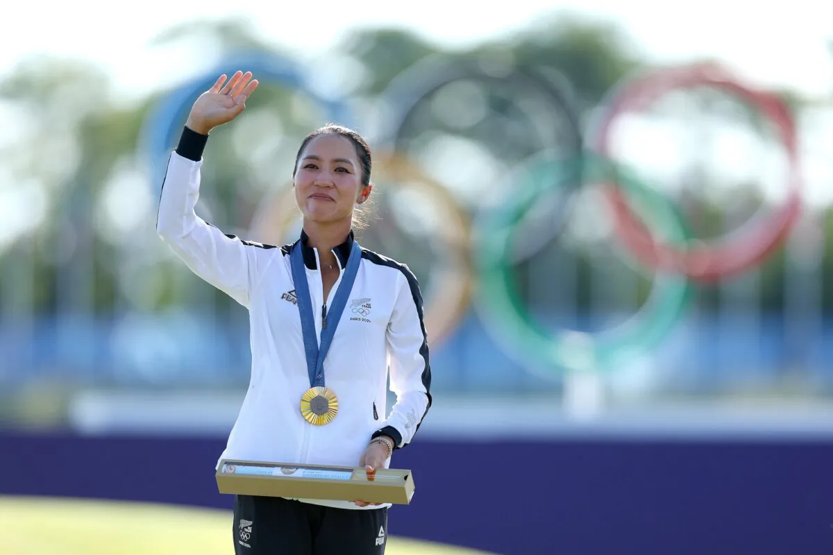 Gold medalist, Lydia Ko of Team New Zealand celebrates on the podium during the Women's Individual Stroke Play Medal Ceremony on day fifteen of the Olympic Games Paris 2024 in Paris on August 10, 2024. (Andrew Redington/Getty Images)