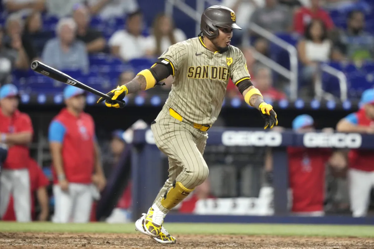 San Diego Padres' Luis Arraez follows through on a single to score Bryce Johnson during the eighth inning of a baseball game against the Miami Marlins in Miami on Aug. 10, 2024. (Lynne Sladky/AP Photo)