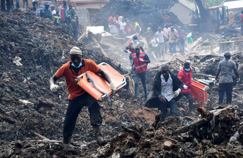 Volunteers arrive to search for the bodies of residents killed by a landslide due to heavy rainfall in a landfill known as Kiteezi that serves as garbage dumping site, in the Lusanja village, outside Kampala, Uganda, on Aug. 10, 2024. (Abubaker Lubowa/Reuters)