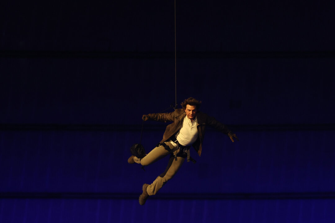 Tom Cruise Leaps From Stadium Roof to Hand Olympic Games to LA