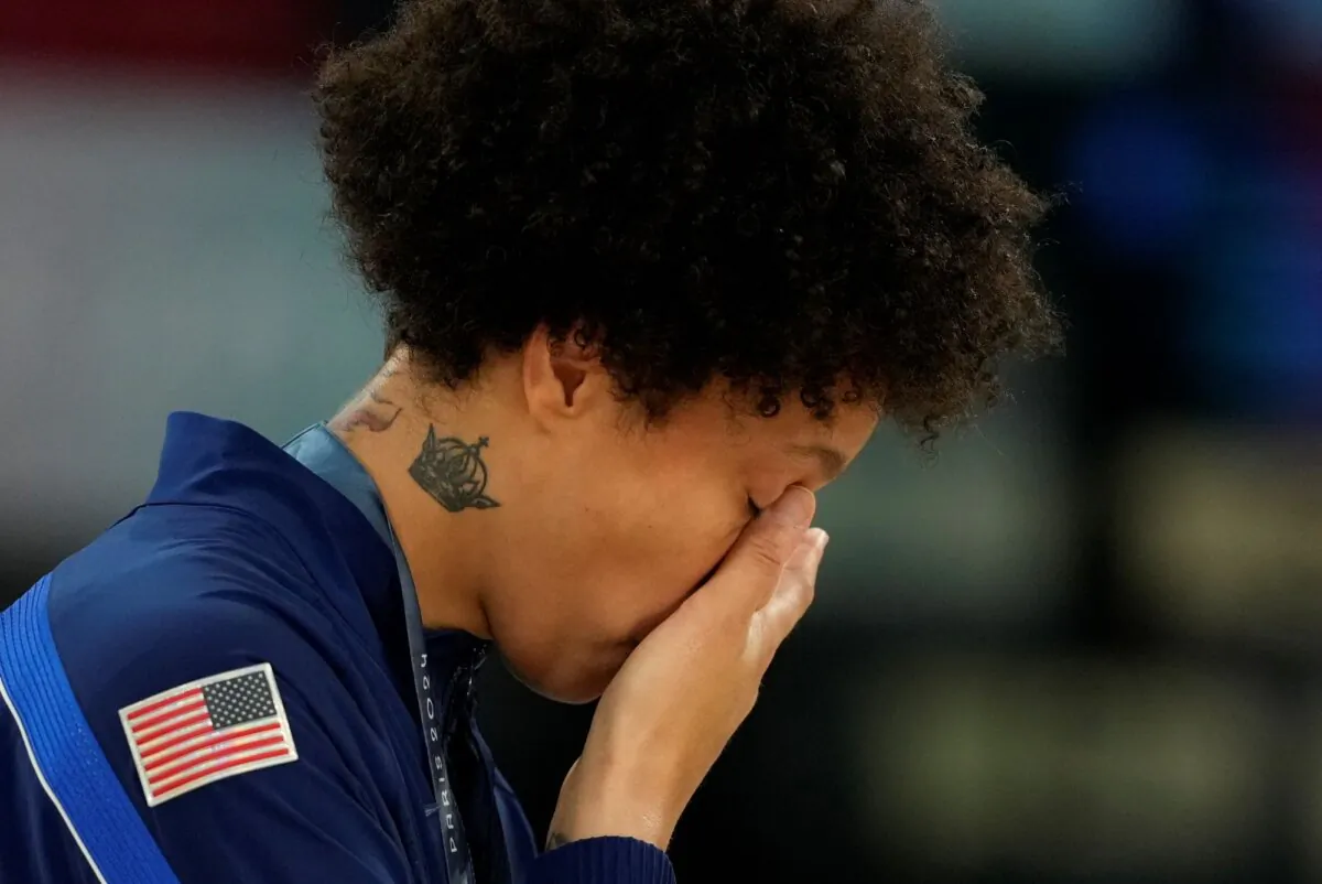 Brittney Griner of Team USA wipes away tears after a women's basketball gold-medal victory over host France in the Paris Olympics on Aug. 11, 2024. (Mark J. Terrill/AP Photo)
