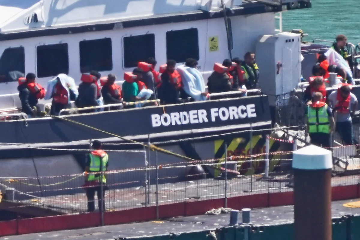 A group of people thought to be migrants are brought in on a Border Force vessel following a small boat incident in the English Channel in Dover, England, on Aug. 5, 2024. (Gareth Fuller/PA Wire)
