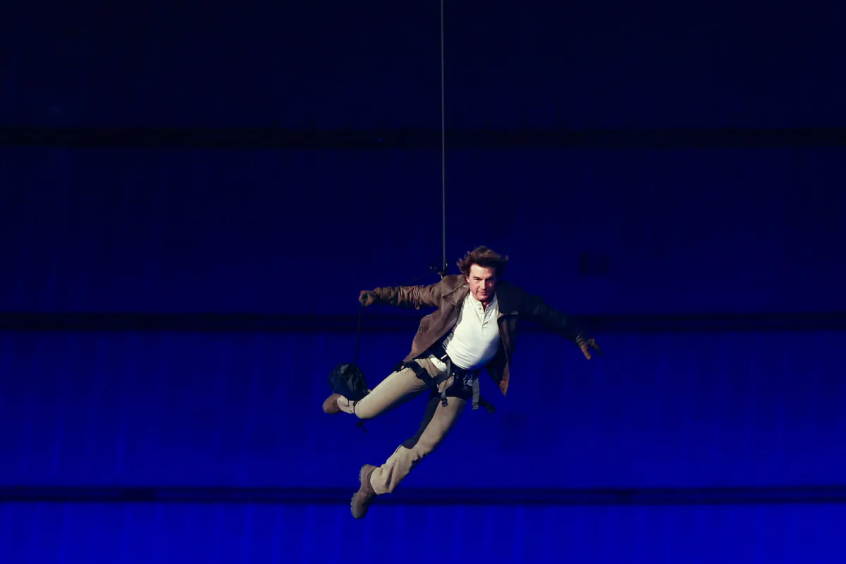 U.S. actor Tom Cruise lands on the roof of one of the stadium entrances during the closing ceremony of the Paris 2024 Olympic Games at the Stade de France, in Saint-Denis, in the outskirts of Paris, on Aug. 11, 2024. (Franck Fife/AFP via Getty Images)