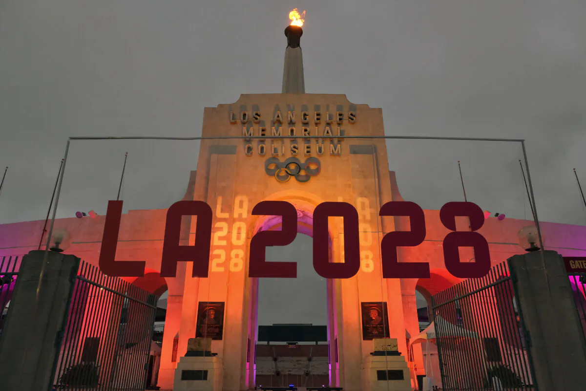 An LA 2028 sign in front of the Olympic cauldron at the Los Angeles Memorial Coliseum on Sept. 13, 2017. (Richard Vogel/AP Photo)