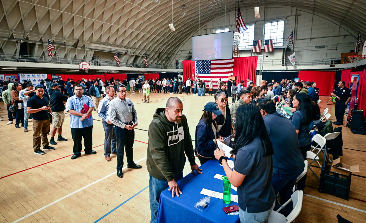 People wait in line to speak with prospective employers during a career fair in Los Angeles, Calif., on Nov. 2, 2023. (Frederic J. Brown/AFP via Getty Images)