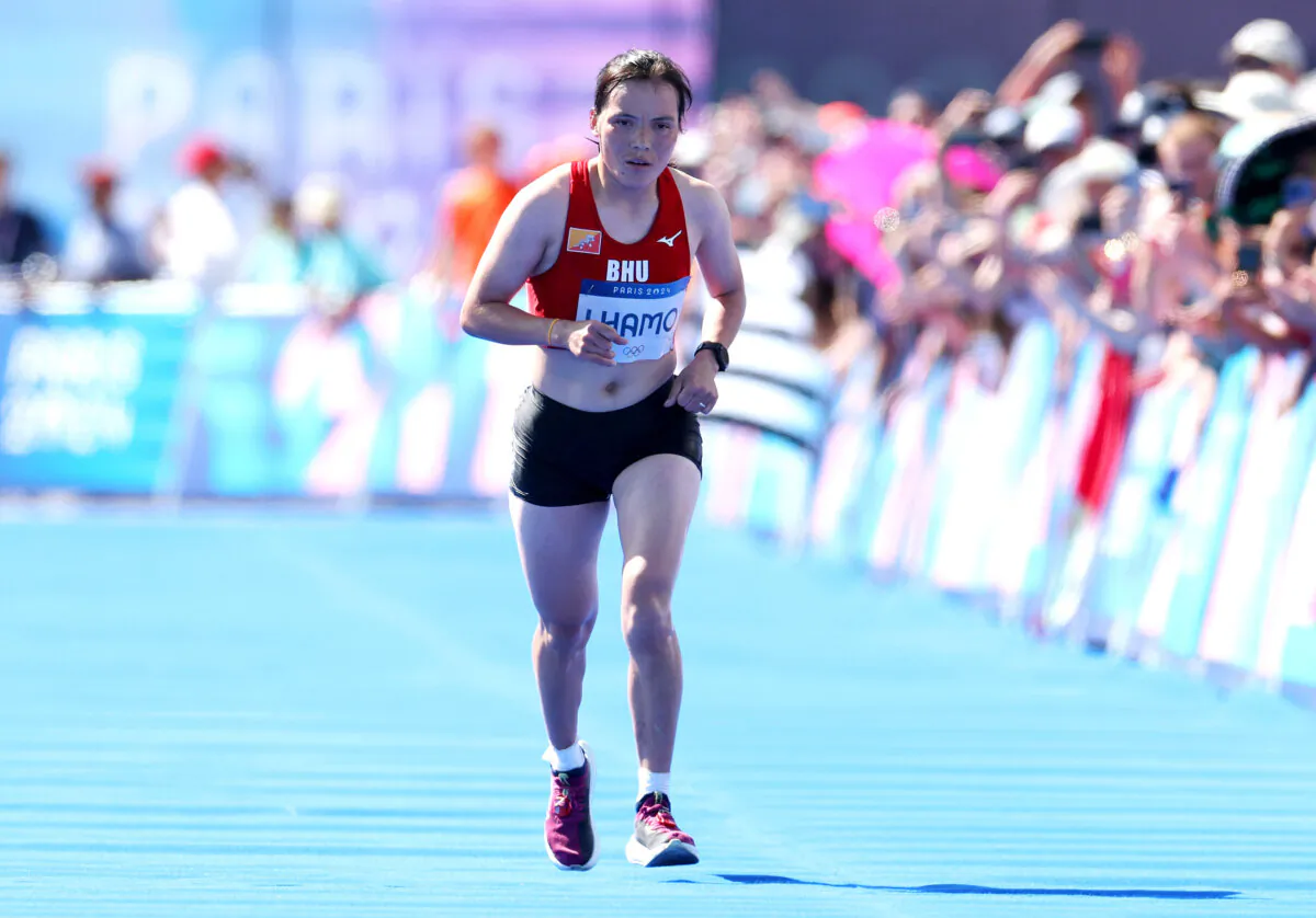 PARIS, FRANCE - AUGUST 11: Kinzang Lhamo of Team Bhutan competes during the Women's Marathon on day sixteen of the Olympic Games Paris 2024 at Esplanade Des Invalides on August 11, 2024 in Paris, France. (Photo by Michael Steele/Getty Images)