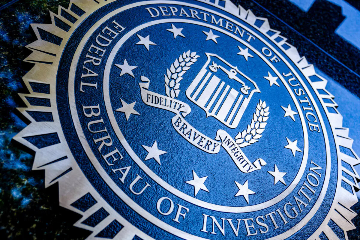 A seal reading "Department of Justice Federal Bureau of Investigation" is displayed on the J. Edgar Hoover FBI building in Washington, D.C., on Aug. 9, 2022. (Stefani Reynolds/AFP via Getty Images)