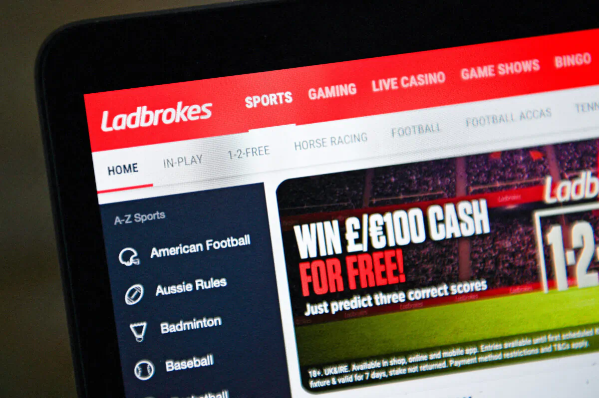 A photo illustration shows the website of Ladbrokes betting shop in London, the UK, on Sept. 22, 2021. (Daniel Leal/AFP via Getty Images)