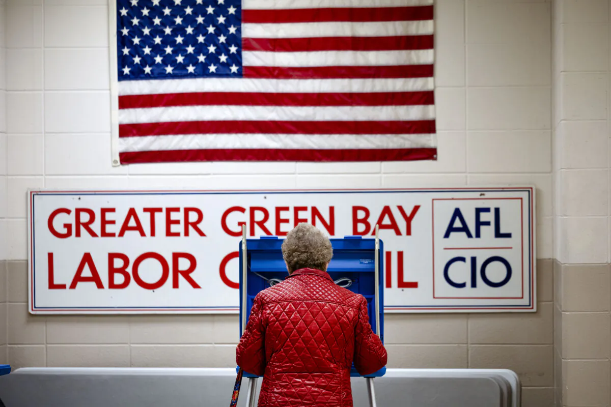 A voter casts her ballot in the state's primary election at a polling location in Green Bay, Wis., on April 2, 2024. (Scott Olson/Getty Images)