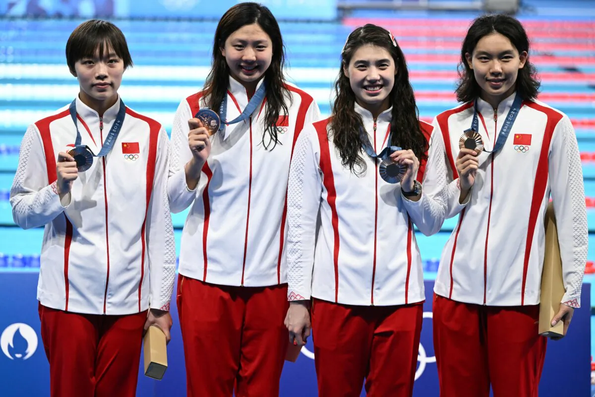 Bronze medallists Team China China's Wan Letian, China's Tang Qianting, China's Zhang Yufei and China's Yang Junxuan pose after the podium of the women's 4x100m medley relay swimming event during the Paris 2024 Olympic Games on Aug. 4, 2024. (SEBASTIEN BOZON/AFP via Getty Images)