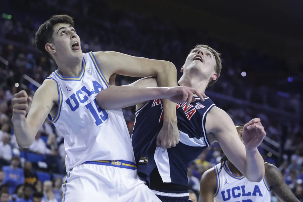 Aday Mara of UCLA and Arizona's Motiejus Krivas battle for position during a Pacific-12 Conference basketball game in Los Angeles on March 7, 2024. (Yannick Peterhans/USA TODAY via Field Level Media)