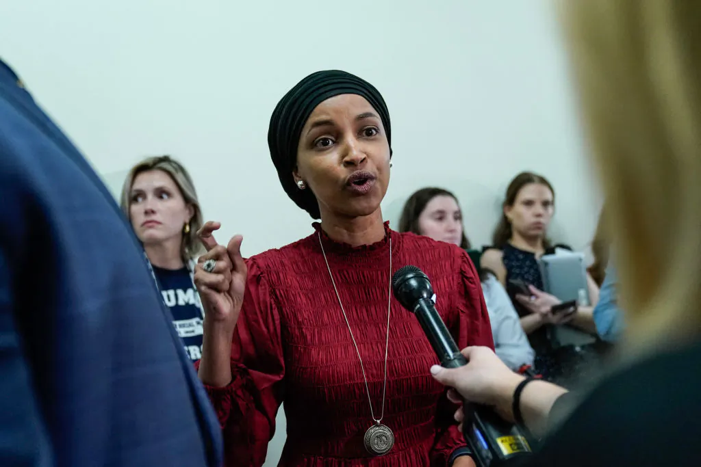 Rep Ilhan Omar (D-Min.) speaks to reporters in the hallway outside a House Committee on Education and the Workforce hearing at Capitol Hill in Washington, on April 17, 2024. (Drew Angerer/AFP via Getty Images)