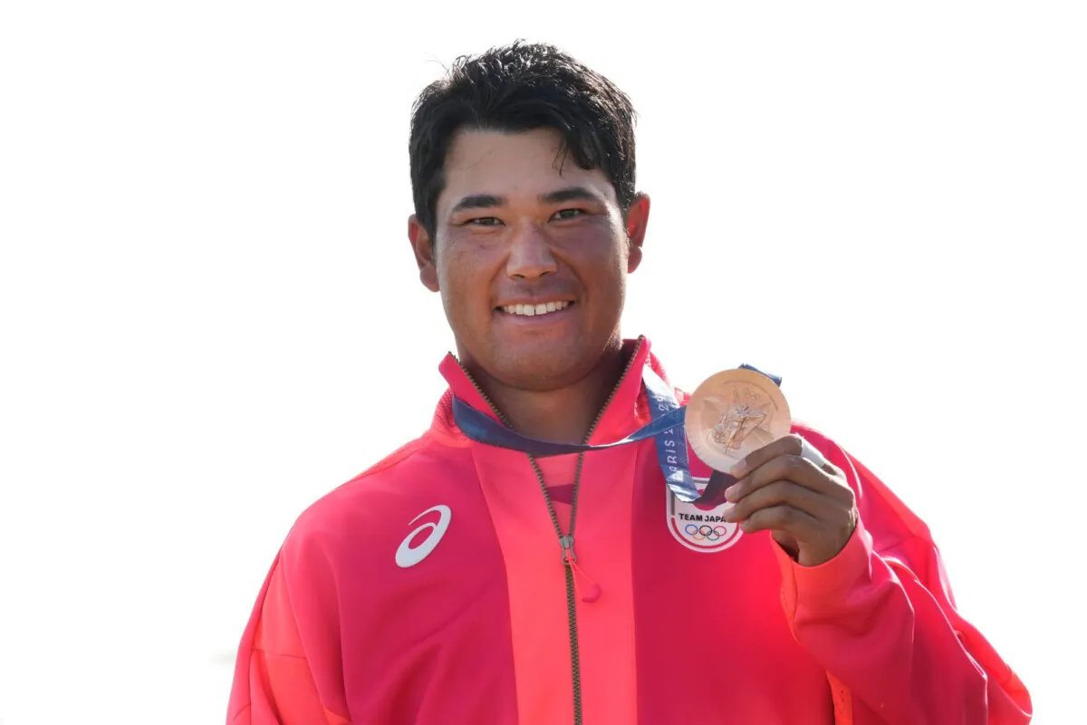 Hideki Matsuyama of Japan poses with his men's golf bronze medal at the Summer Olympics in Saint-Quentin-en-Yvelines, France, on Aug. 4, 2024. (Matt York/AP Photo)