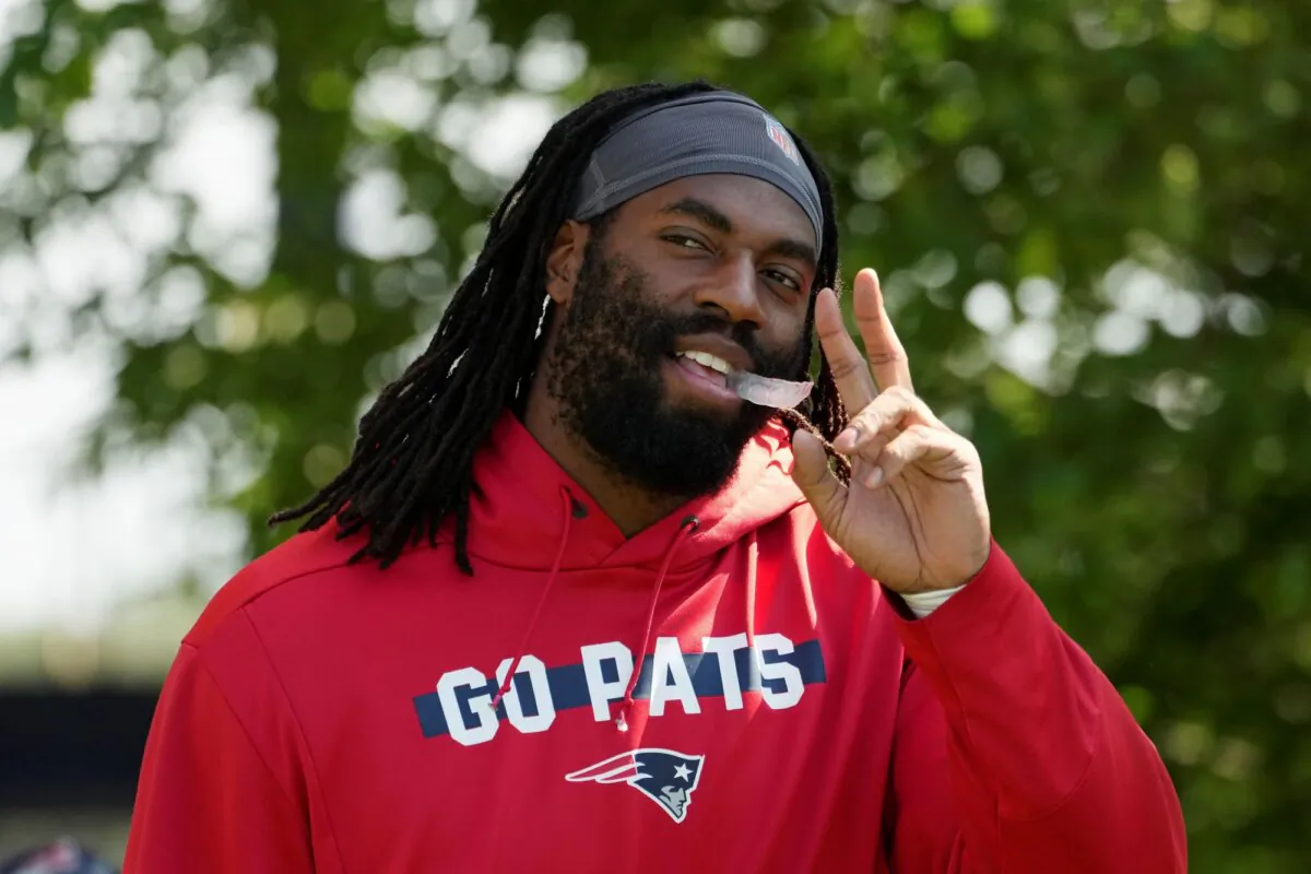 New England Patriots linebacker Matthew Judon walks onto the field during a joint practice with the Philadelphia Eagles in Foxborough, Mass., on Aug. 13, 2024. (Michael Dwyer/AP Photo)