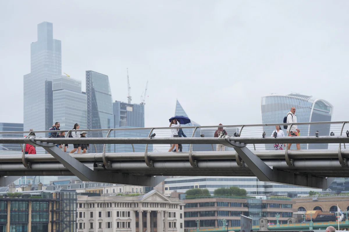 File photo of people crossing the Millennium Bridge in London on Aug. 8, 2024. (Yui Mok/PA Wire)