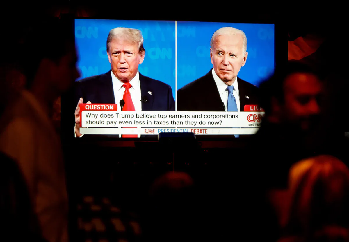People watch the CNN presidential debate between President Joe Biden and former President Donald Trump at a debate watch party at The Continental Club in Los Angeles on June 27, 2024. (Mario Tama/Getty Images)