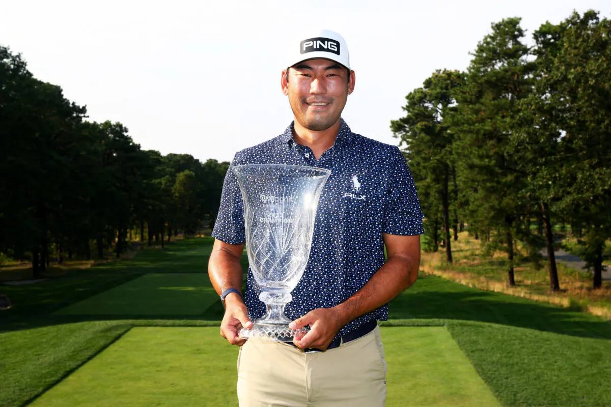 Chan Kim poses for a photo after winning the 2023 Magnit Championship at Metedeconk National Golf Club in Jackson, N.J. on Aug. 20, 2023. (Mike Stobe/Getty Images)