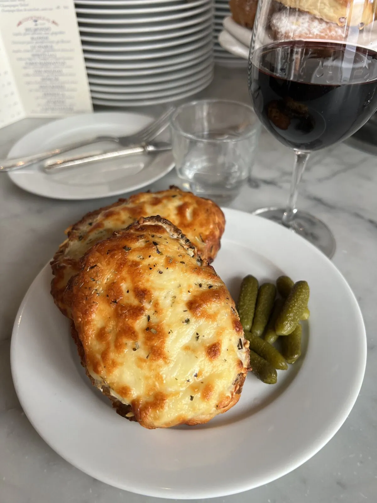 A croque monsieur sandwich at Buvette in Paris is served with cornichons. (Gretchen McKay/Pittsburgh Post-Gazette/TNS)