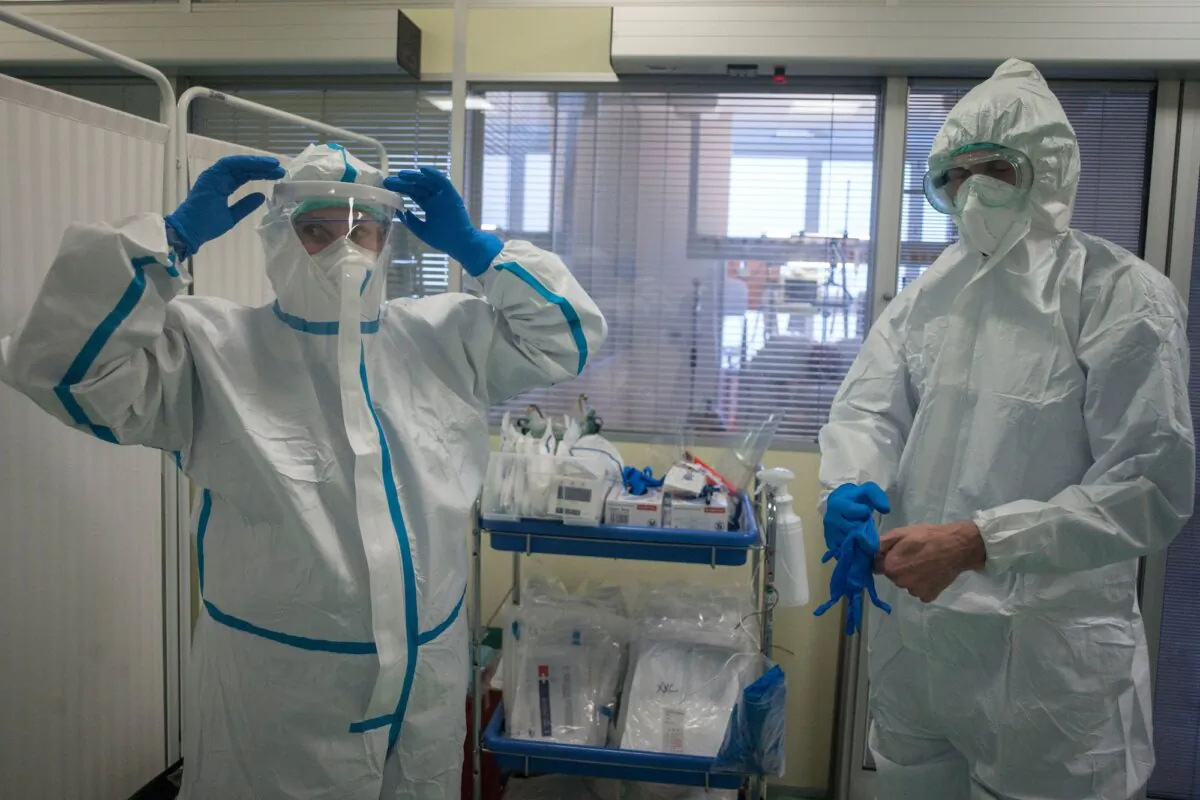 Health care workers put on personal protective equipment at an intensive care unit at Thomayer hospital, in Prague, Czech Republic, on Oct. 14, 2020. (Michal Cizek/AFP/Getty Images)