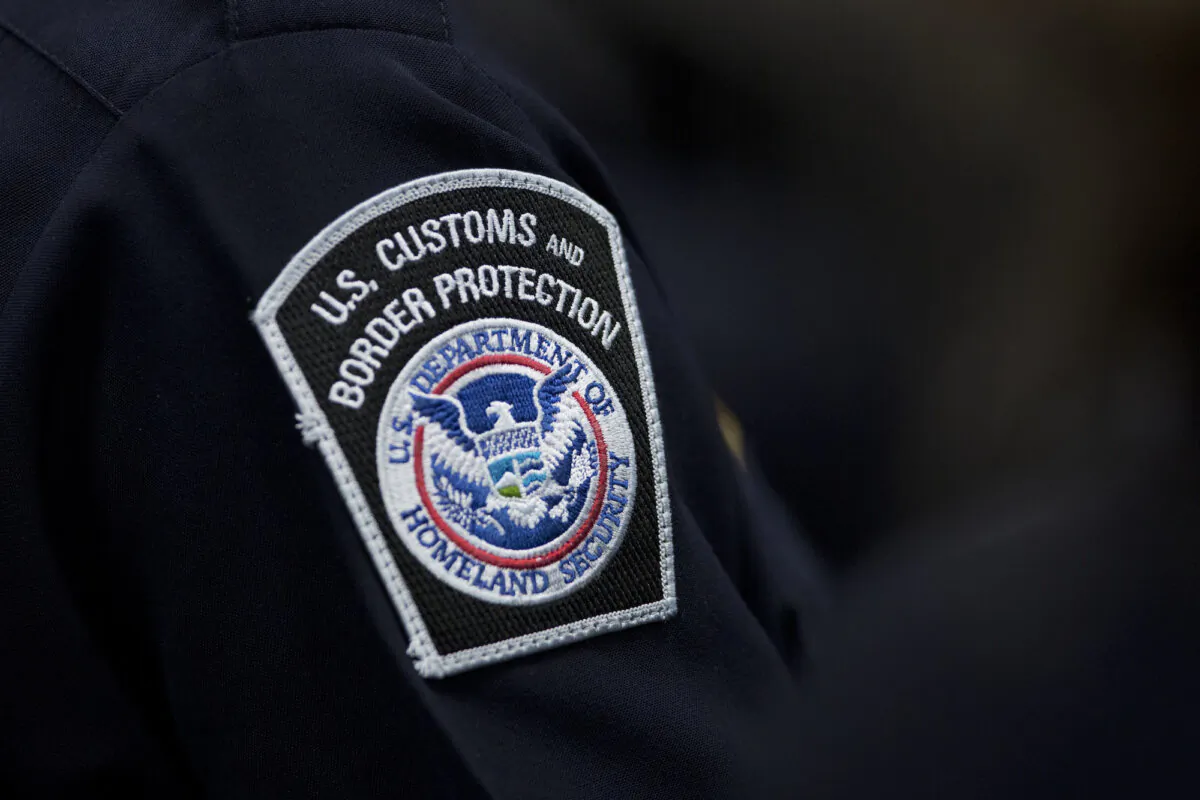 A customs agent wears a patch for the U.S. Customs and Border Protection agency in a file photo taken Oct. 27, 2017, at John F. Kennedy International Airport in New York. (Mark Lennihan/AP Photo)