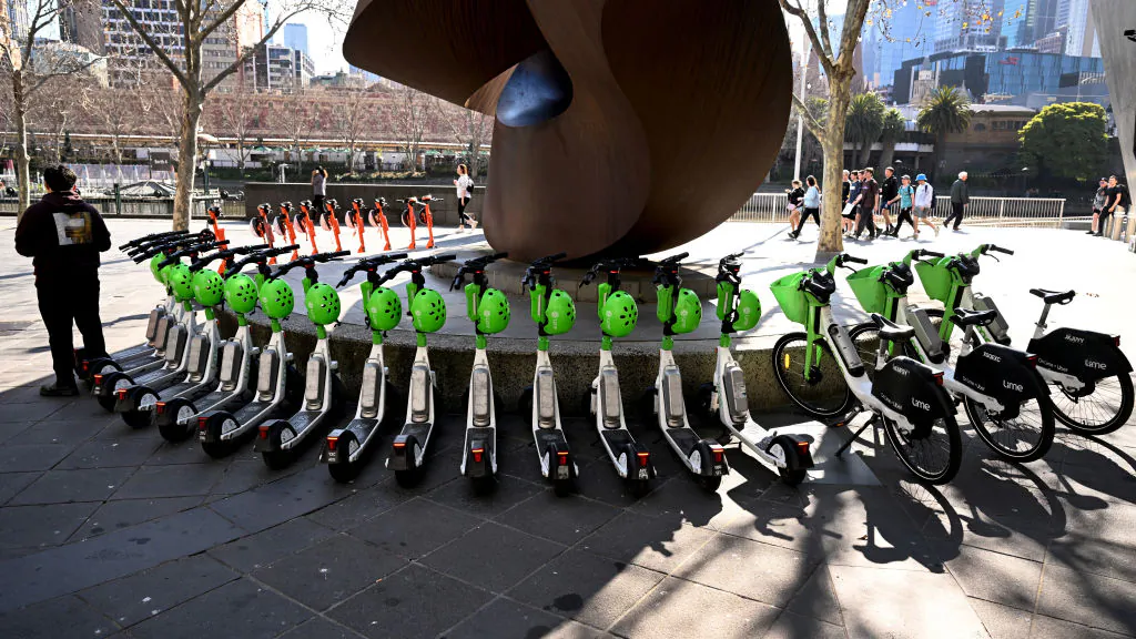 Hire e-scooters are lined up in Melbourne's central business district (CBD) on August 13, 2024. Melbourne has become the latest city to announce a ban on rental e-scooters, abruptly moving to end a trial contract with two firms after a community revolt. (Photo by William WEST / AFP) (Photo by WILLIAM WEST/AFP via Getty Images)