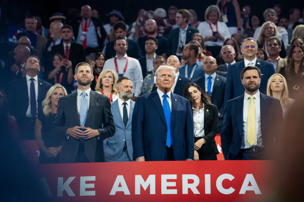 (L-R) Eric Trump, former President Donald Trump, and his running mate Sen. JD Vance (R-Ohio) arrive at the RNC in Milwaukee on July 16, 2024. (Madalina Vasiliu/The Epoch Times)