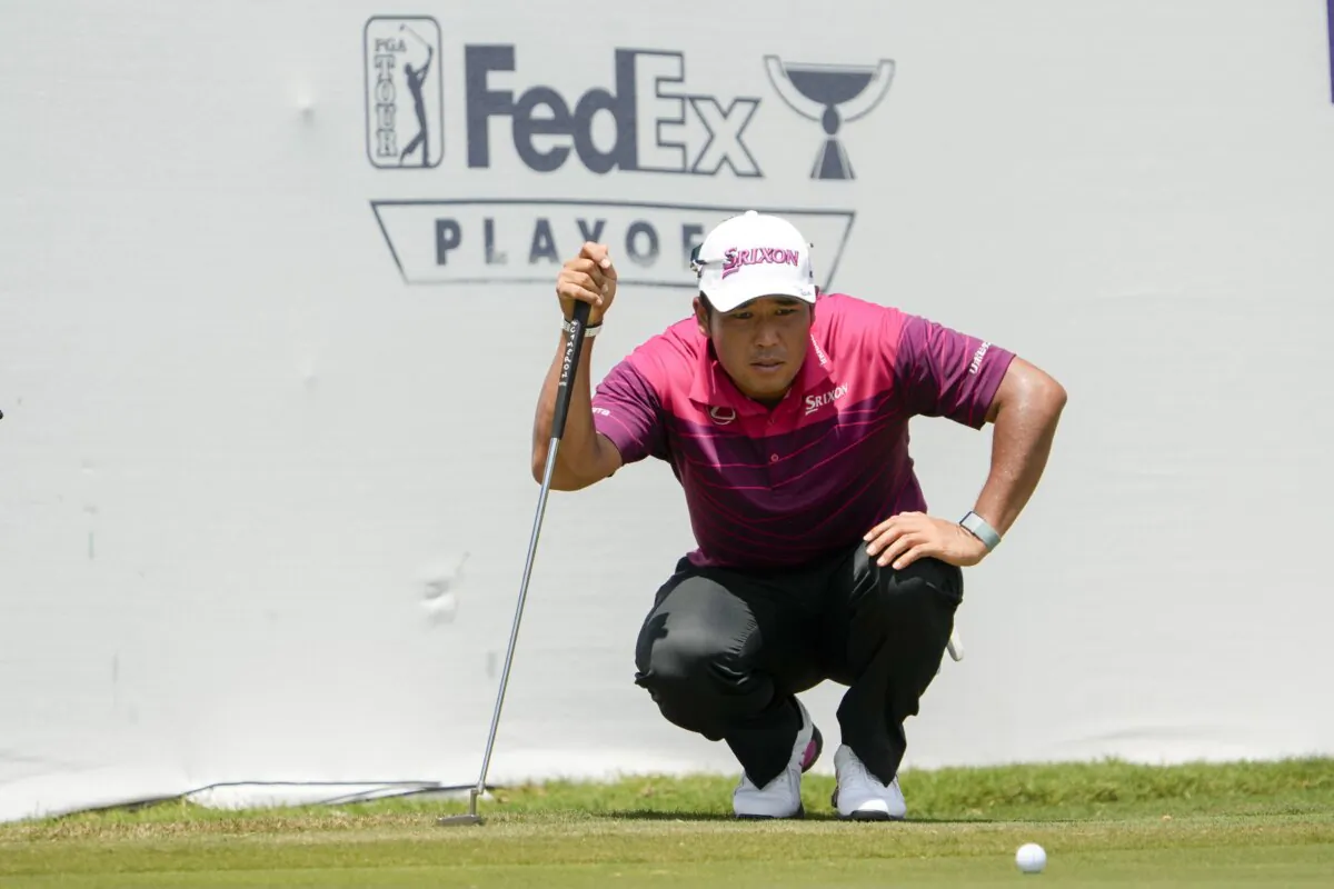 Hideki Matsuyama, of Japan, lines up his putt on the 17th green during the second round of the St. Jude Championship golf tournament in Memphis on Aug. 16, 2024. (Mark Humphrey/AP Photo)