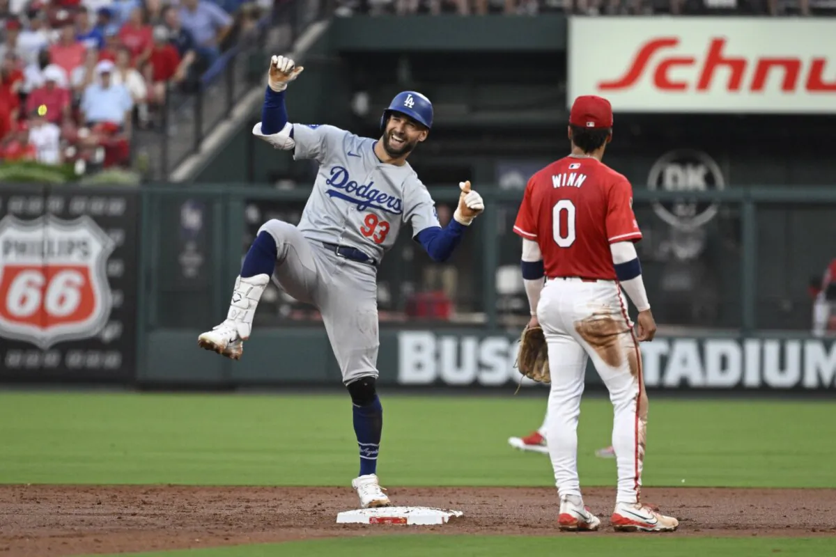 Los Angeles Dodgers' Kevin Kiermaier (93) reacts after advancing to second on a throwing error form St. Louis Cardinals right fielder Jordan Walker (not shown) during the first inning of a baseball game in St. Louis on Aug. 16, 2024. (AP Photo/Jeff Le)